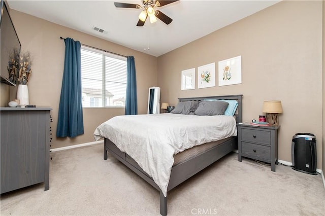 12440 Constellation St, Eastvale, CA 91752 - bedroom with light colored carpet, baseboards, and ceiling fan