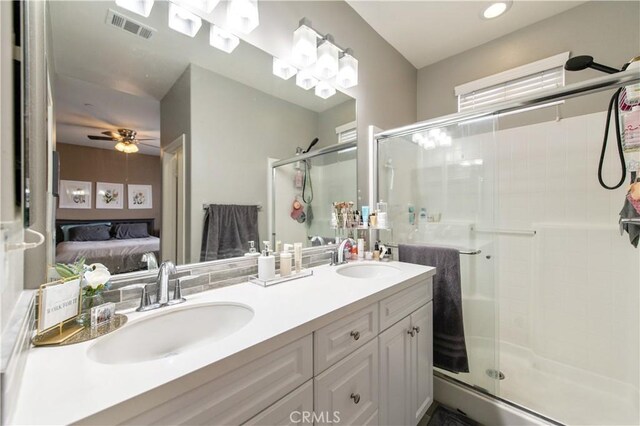 12440 Constellation St, Eastvale, CA 91752 - bathroom with ensuite bathroom, a shower stall, double vanity, and a ceiling fan