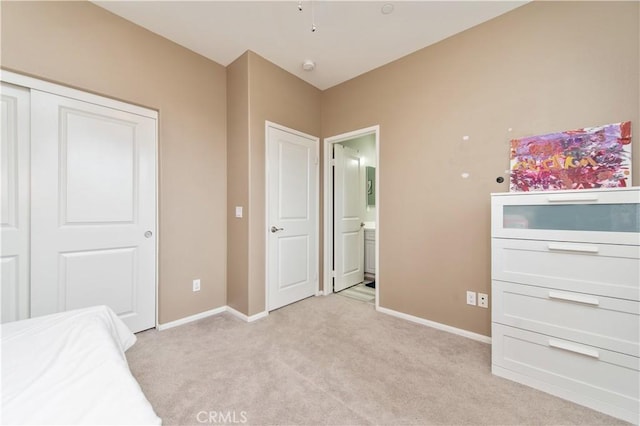 12440 Constellation St, Eastvale, CA 91752 - unfurnished bedroom featuring light colored carpet, baseboards, connected bathroom, and a closet