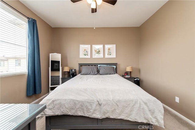 12440 Constellation St, Eastvale, CA 91752 - carpeted bedroom featuring multiple windows, ceiling fan, and baseboards