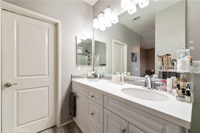 12440 Constellation St, Eastvale, CA 91752 - full bath featuring double vanity and wood finished floors
