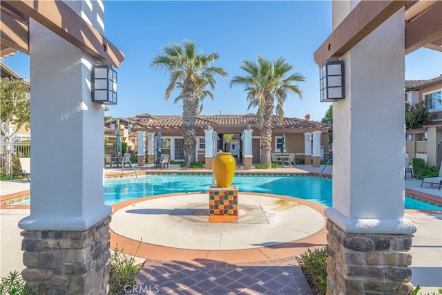 community pool with a patio