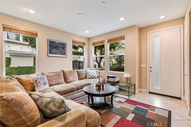living room with light tile patterned floors, recessed lighting, and baseboards