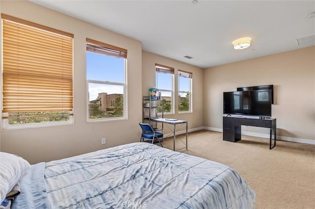 carpeted bedroom featuring baseboards