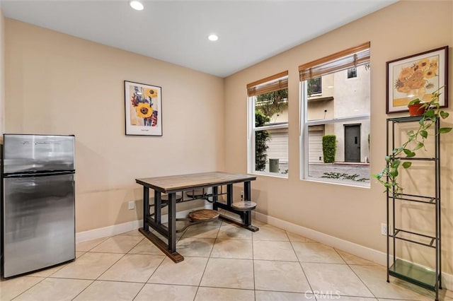 dining area with baseboards, recessed lighting, and light tile patterned floors