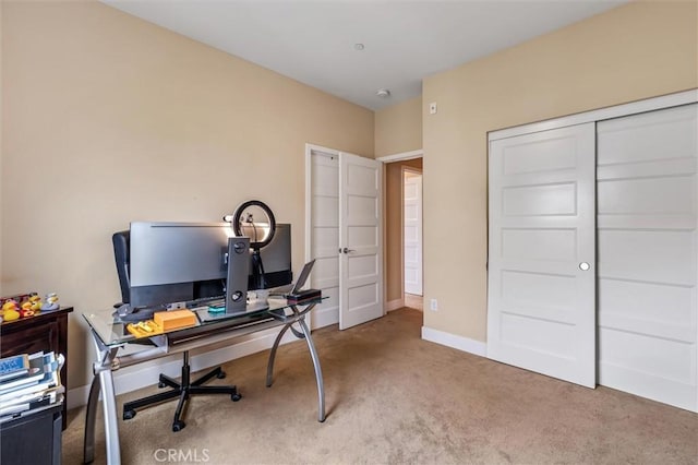 carpeted office with baseboards
