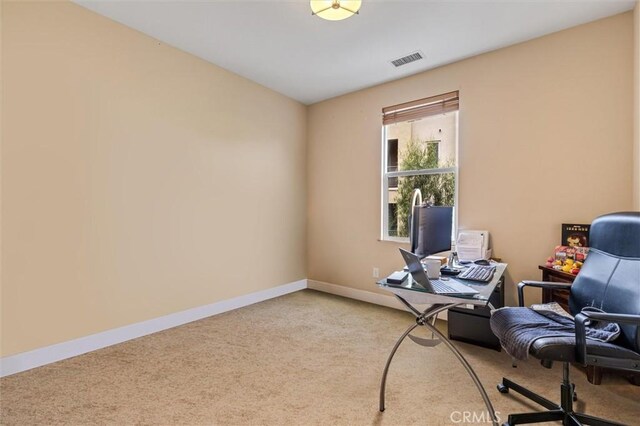 office featuring light colored carpet and baseboards