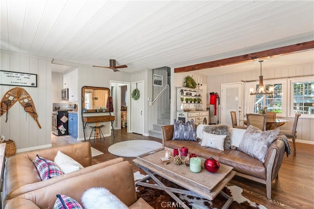 living area featuring wood finished floors, stairway, wooden ceiling, a ceiling fan, and a chandelier