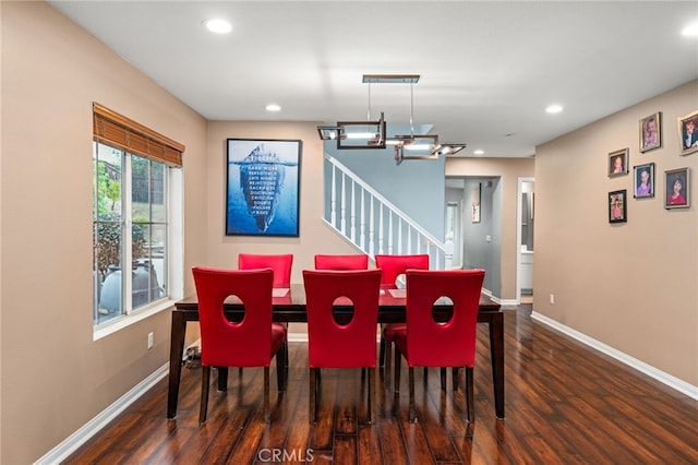 dining space with wood finished floors, baseboards, recessed lighting, a chandelier, and stairs