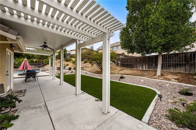 view of patio with ceiling fan and a pergola