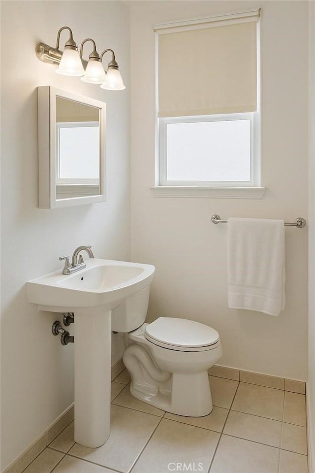 1600 N Hobart Blvd Unit 16, Los Angeles, CA 90027 - half bathroom with tile patterned flooring, toilet, and baseboards
