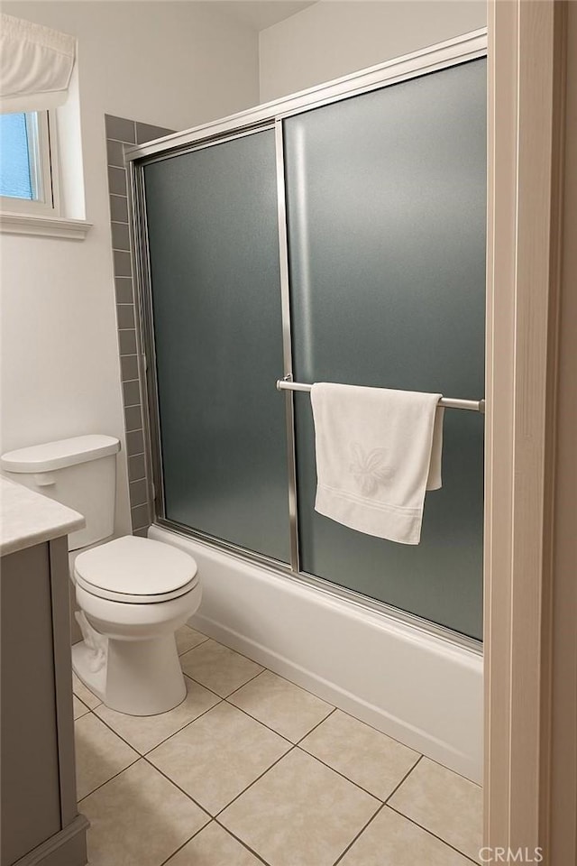 1600 N Hobart Blvd Unit 16, Los Angeles, CA 90027 - full bathroom featuring toilet, combined bath / shower with glass door, tile patterned floors, and vanity