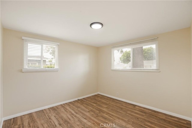 1808 W Palm Dr, West Covina, CA 91790 - empty room with baseboards and wood finished floors