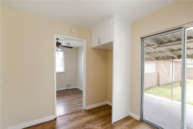 1808 W Palm Dr, West Covina, CA 91790 - unfurnished dining area with light wood-type flooring, baseboards, and a ceiling fan