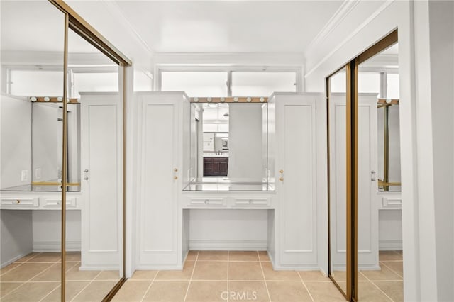 10356 Claire Ave, Porter Ranch, CA 91326 - hall with light tile patterned floors, baseboards, and crown molding