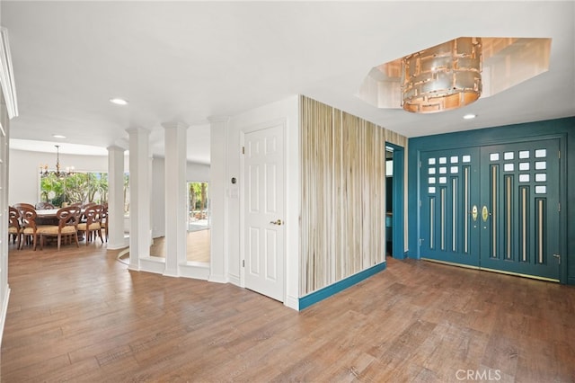 10356 Claire Ave, Porter Ranch, CA 91326 - foyer entrance with wood finished floors, a chandelier, recessed lighting, and baseboards