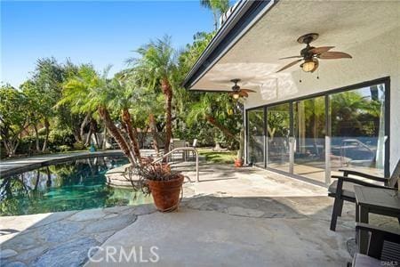 10356 Claire Ave, Porter Ranch, CA 91326 - view of patio featuring a ceiling fan and an outdoor pool