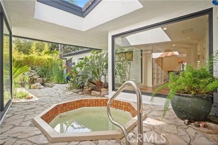 10356 Claire Ave, Porter Ranch, CA 91326 - unfurnished sunroom with a skylight and a hot tub
