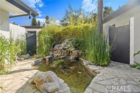 10356 Claire Ave, Porter Ranch, CA 91326 - view of yard with a patio area and a garden pond