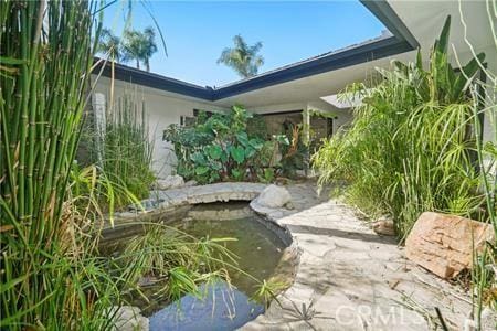 10356 Claire Ave, Porter Ranch, CA 91326 - exterior space with a garden pond