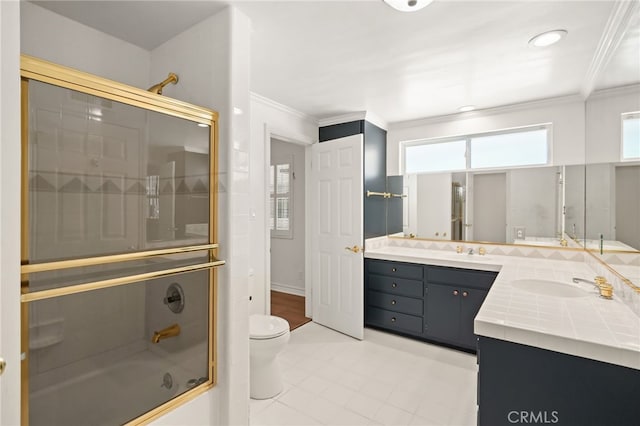 10356 Claire Ave, Porter Ranch, CA 91326 - full bath featuring ornamental molding, shower / bath combination with glass door, toilet, double vanity, and tile patterned flooring