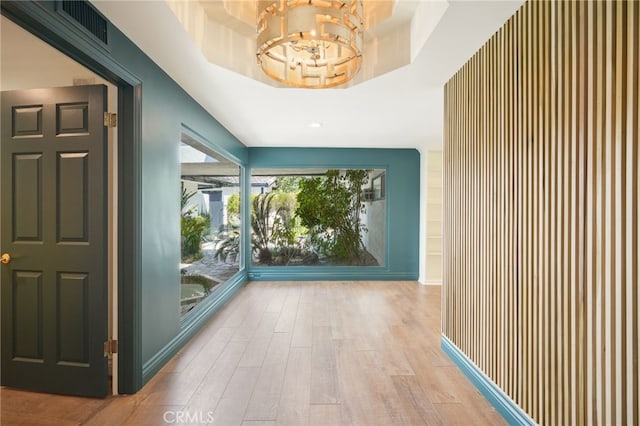 10356 Claire Ave, Porter Ranch, CA 91326 - corridor with wood finished floors and a chandelier