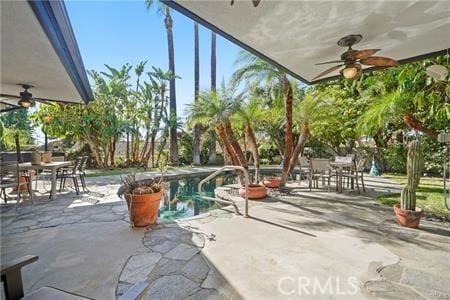 10356 Claire Ave, Porter Ranch, CA 91326 - view of patio featuring a ceiling fan, outdoor dining space, and an outdoor pool