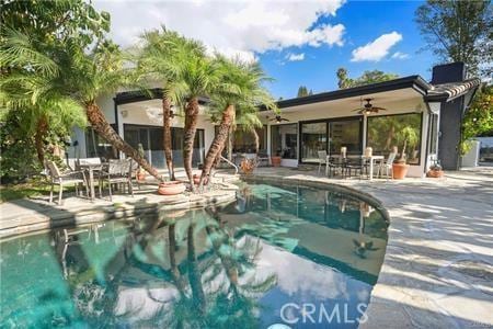 10356 Claire Ave, Porter Ranch, CA 91326 - swimming pool featuring ceiling fan, a patio area, and outdoor dining space