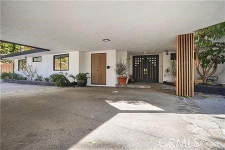 10356 Claire Ave, Porter Ranch, CA 91326 - doorway to property featuring stucco siding