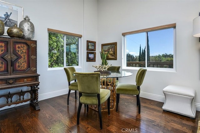 4950 Campo Rd, Woodland Hills, CA 91364 - dining room with baseboards, wood finished floors, and a towering ceiling