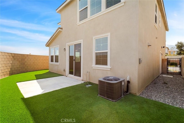 17210 Pioneer Way, San Bernardino, CA 92407 - back of house featuring stucco siding, a fenced backyard, a gate, and a patio area