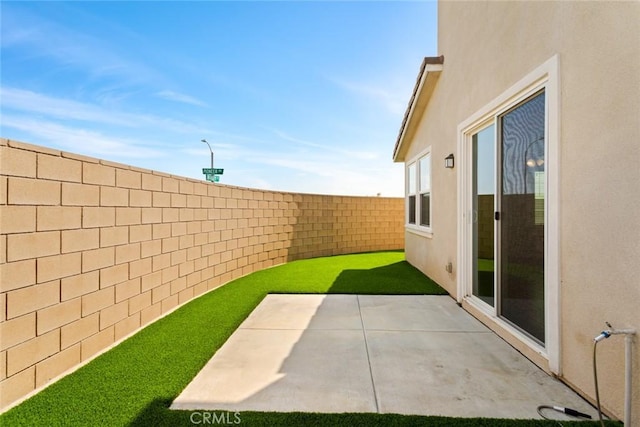 17210 Pioneer Way, San Bernardino, CA 92407 - fenced backyard featuring a patio