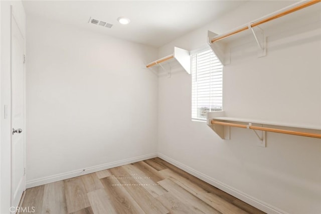 17210 Pioneer Way, San Bernardino, CA 92407 - walk in closet with light wood finished floors