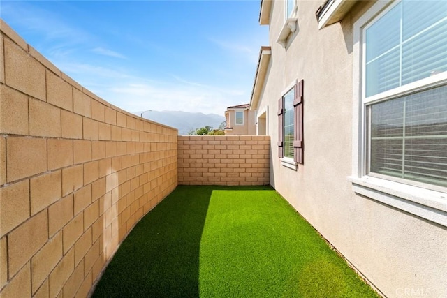 17210 Pioneer Way, San Bernardino, CA 92407 - fenced backyard featuring a mountain view