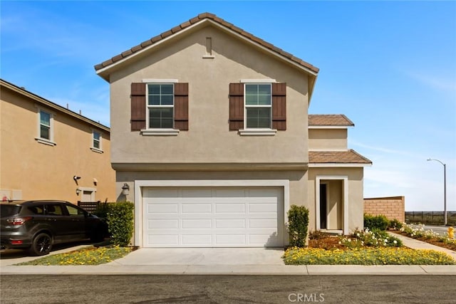 17210 Pioneer Way, San Bernardino, CA 92407 - traditional-style house featuring concrete driveway, an attached garage, and stucco siding