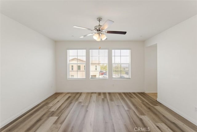 17210 Pioneer Way, San Bernardino, CA 92407 - unfurnished room with light wood-style floors, plenty of natural light, and a ceiling fan