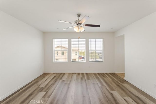 17210 Pioneer Way, San Bernardino, CA 92407 - unfurnished room featuring light wood finished floors, healthy amount of natural light, and a ceiling fan