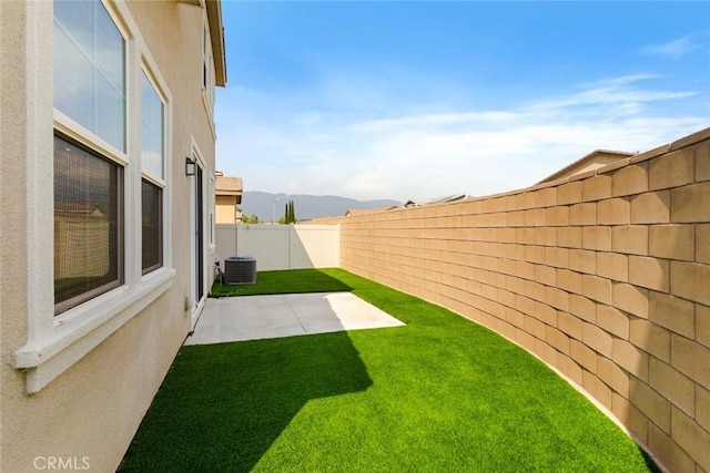 17210 Pioneer Way, San Bernardino, CA 92407 - fenced backyard with a patio and a mountain view