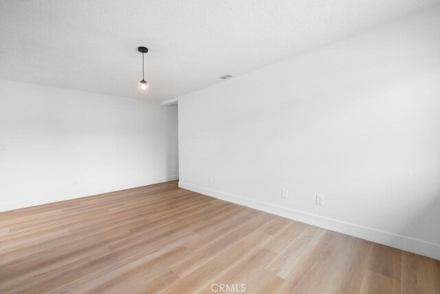 18103 Camino Bello Unit 4, Rowland Heights, CA 91748 - spare room with light wood-style flooring and baseboards