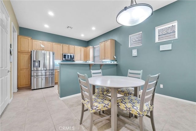 440 Brooklawn Dr, Banning, CA 92220 - dining space featuring light tile patterned floors, recessed lighting, and baseboards