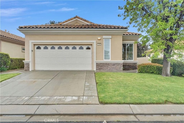 440 Brooklawn Dr, Banning, CA 92220 - mediterranean / spanish-style house with stone siding, stucco siding, a front yard, driveway, and a tile roof