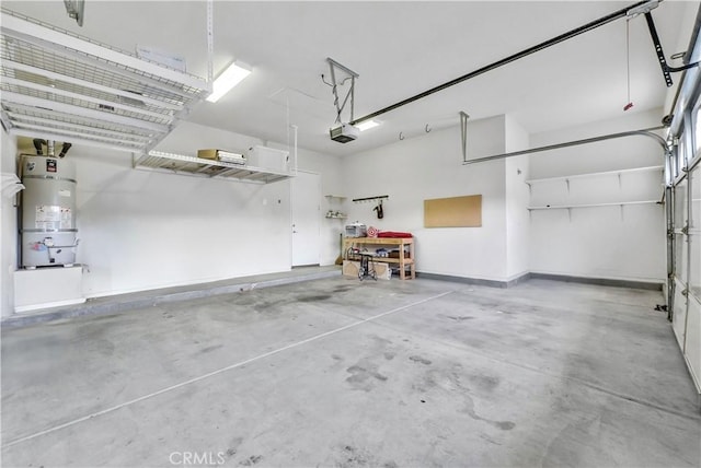 440 Brooklawn Dr, Banning, CA 92220 - garage featuring strapped water heater and a garage door opener