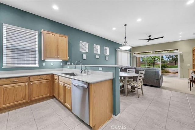 440 Brooklawn Dr, Banning, CA 92220 - kitchen with stainless steel dishwasher, a sink, a peninsula, open floor plan, and light tile patterned floors