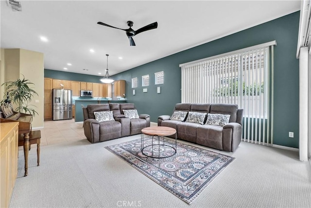 440 Brooklawn Dr, Banning, CA 92220 - living room with a ceiling fan, light colored carpet, recessed lighting, baseboards, and light tile patterned floors