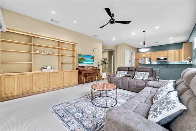 440 Brooklawn Dr, Banning, CA 92220 - living area with a ceiling fan, arched walkways, carpet floors, and recessed lighting