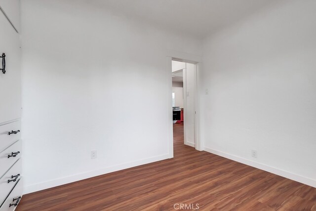 1677 252nd St, Harbor City, CA 90710 - empty room featuring wood finished floors and baseboards
