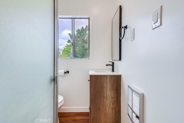 1677 252nd St, Harbor City, CA 90710 - bathroom featuring vanity, wood finished floors, and heating unit