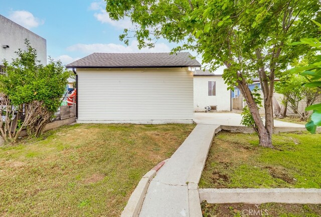 1677 252nd St, Harbor City, CA 90710 - view of property exterior with a patio area and roof with shingles