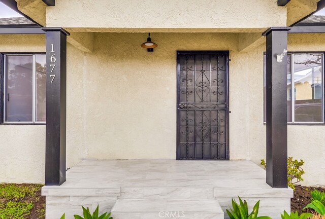 1677 252nd St, Harbor City, CA 90710 - entrance to property with stucco siding