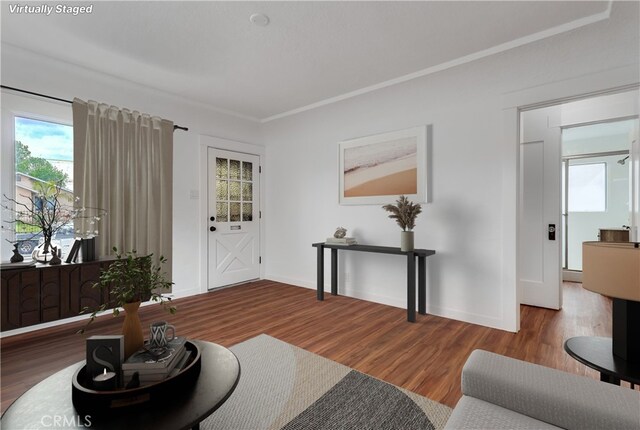 1677 252nd St, Harbor City, CA 90710 - living area featuring wood finished floors, healthy amount of natural light, and crown molding